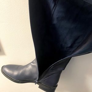 Blue leather rider boots.
